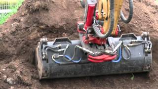 Rototilt RT20B on Cat 3055 loading topsoil [upl. by Latterll]